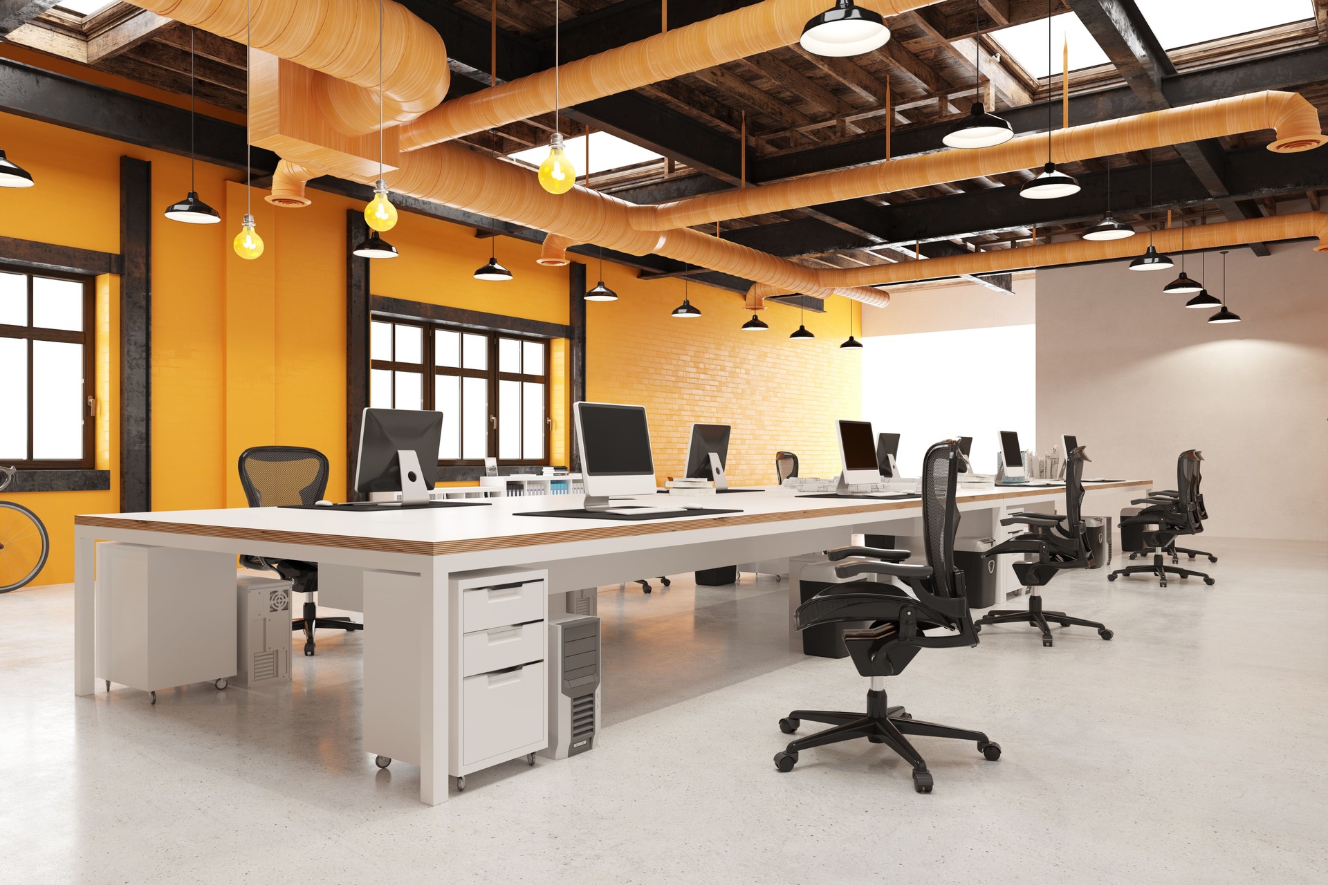 Modern industrial loft office interior. 3D rendering of an empty open-plan workplace with desks and computers. Modern industrial loft office interior. 3D rendering of an empty open-plan workplace with desks and computers.